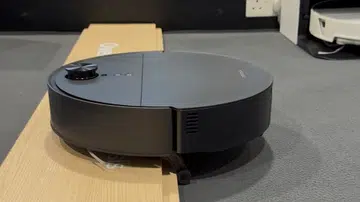This Roborock robot vacuum has legs!