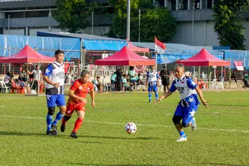 Minister for Law Edwin Tong (centre) playing as part of the Parliament team against Singapore’s legendary 1993 ‘Dream Team’ at Singapore Indian Association’s  fifth annual National Day Sports Fiesta.