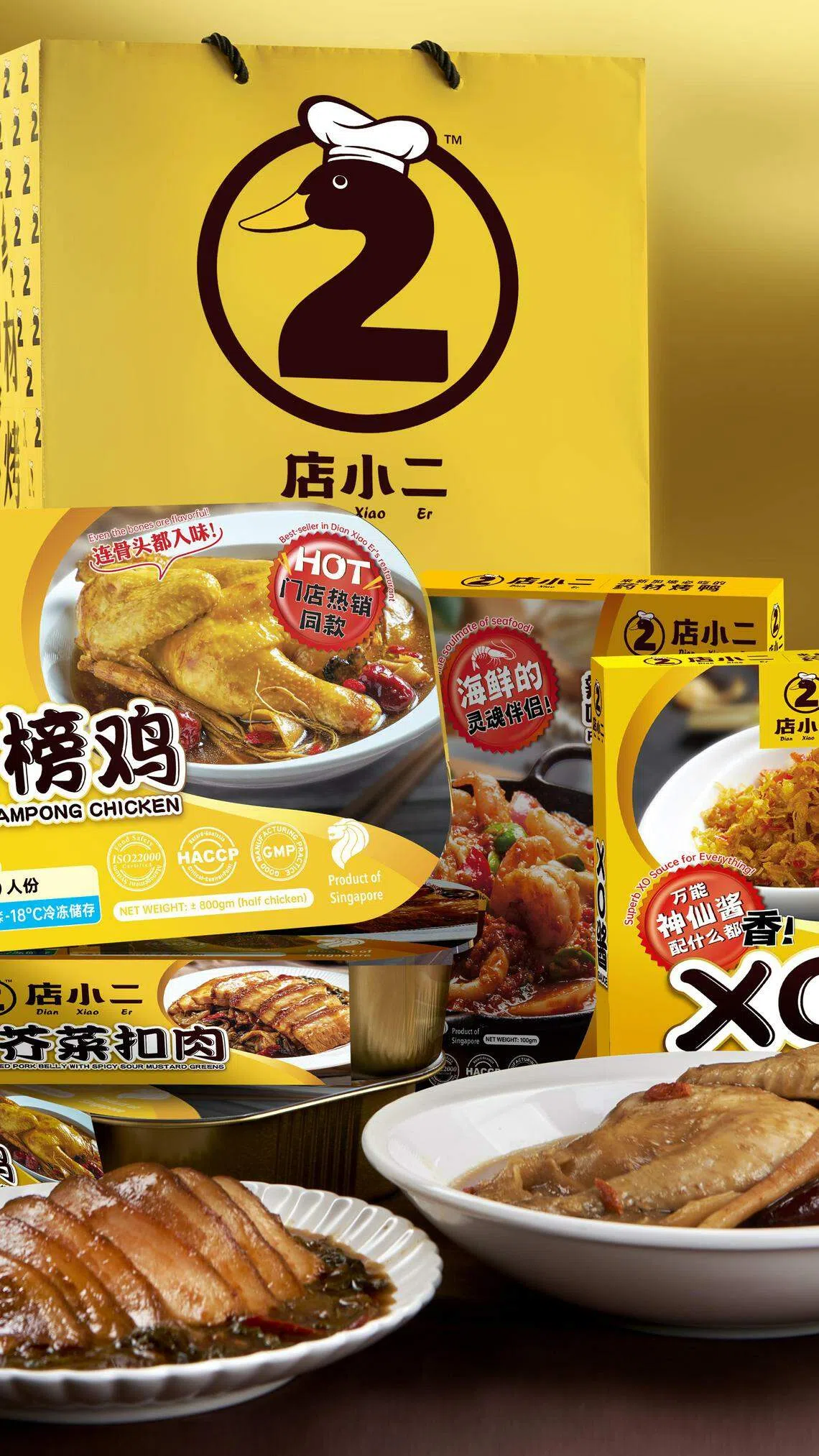 店小二的两款冷冻包现有优惠，人参甘榜鸡两盒$25，酸辣芥菜扣肉三盒$34。（餐馆提供）