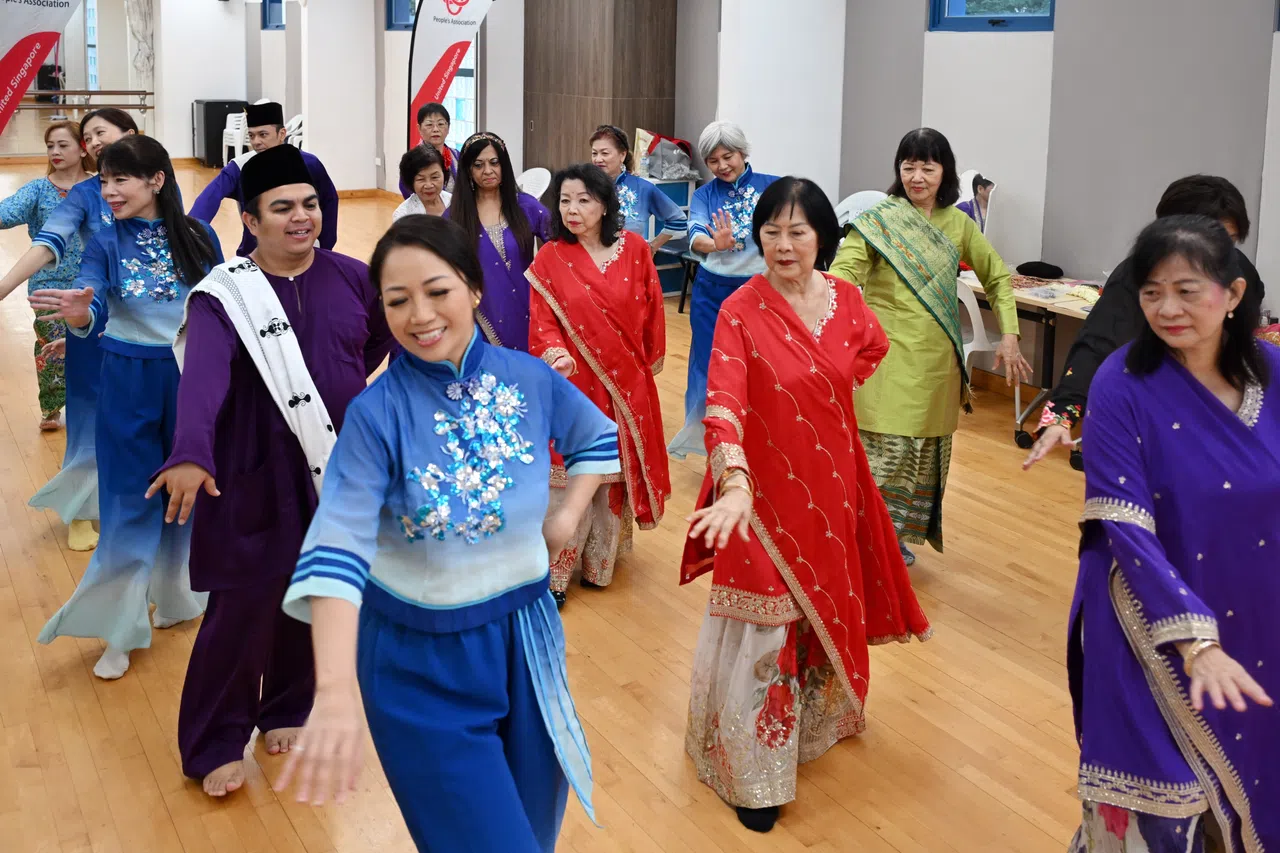 Members of multicultural dance group Lentera Tari, dressed in their traditional costumes, rehearse together at Toa Payoh West CC for Racial Harmony Day.