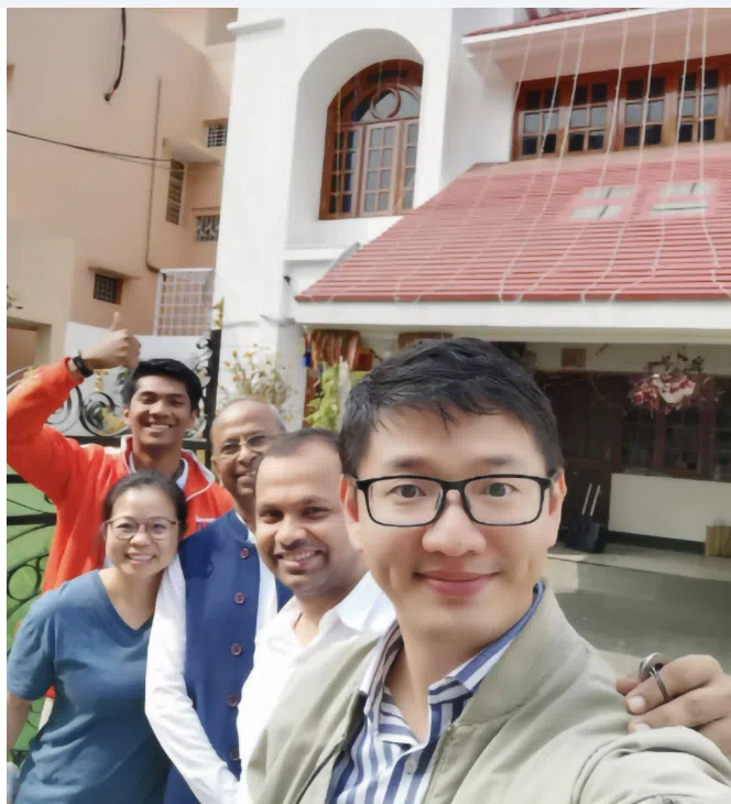 Abhishek Agrawal (second from right) and his father (centre) show his Singapore colleagues around their home in India.