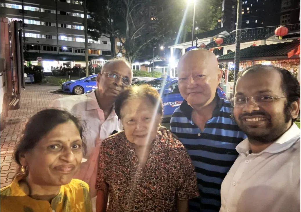 Abhishek Agrawal (far right) poses with his visiting parents (far left and second from left), his 90-year-old Chinese landlord (centre), and the landlord’s son