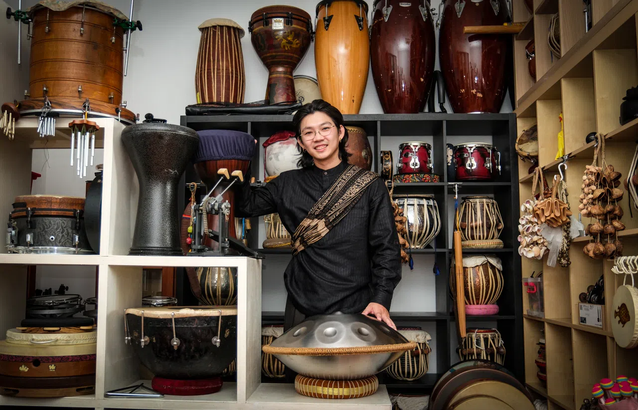 Singapore tabla percussionist Govin Tan with his collection of more than 40 tabla drums, each brought back from India during his music studies there.