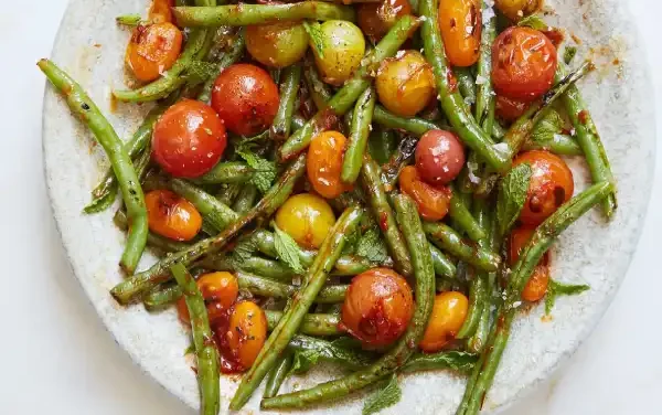 Blistered Green Beans and Tomatoes With Honey, Harissa, and Mint