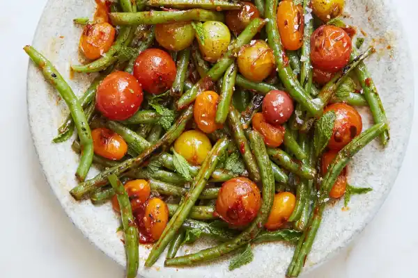 Blistered Green Beans and Tomatoes With Honey, Harissa, and Mint